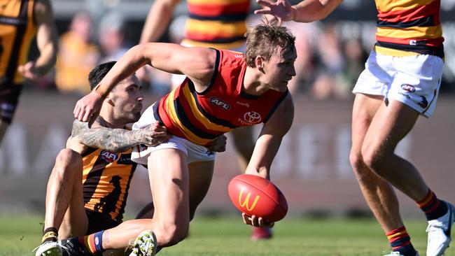 Jordan Dawson is tackled by Chad Wingard.