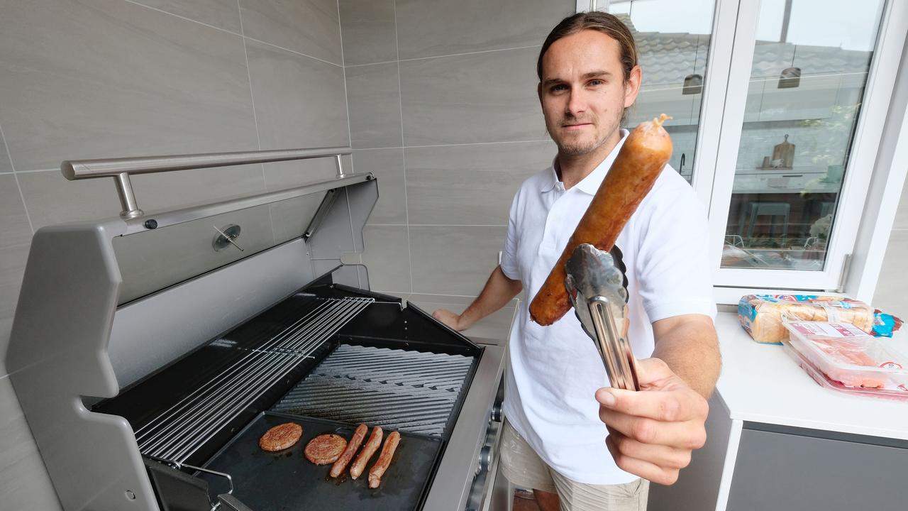Carpenter Jack Harman fires up the barbecue at 336 Myers St, East Geelong. Picture: Mark Wilson