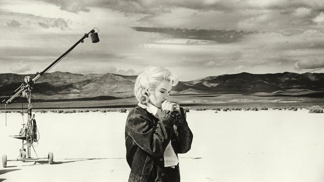 Marilyn Monroe going over lines for a difficult scene with Clark Gable in the Nevada desert for The Misfits in 1960.