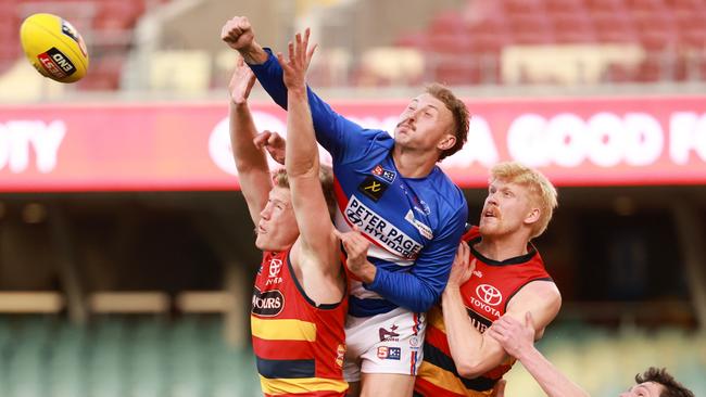 Rhett Montgomerie makes life hard for Crows Fishcer McAsey and Elliot Himmelberg. Picture: SANFL Image/James Elsby