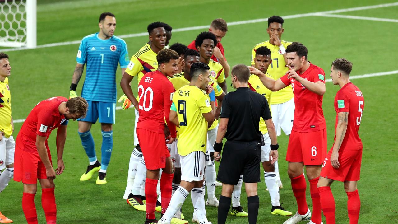 England players urge the referee to consult VAR after the headbutt on Henderson.