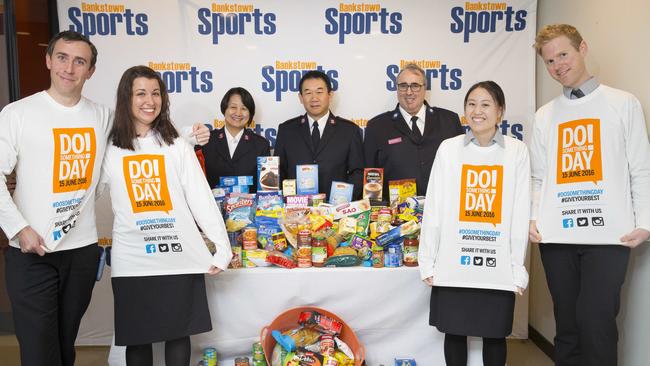 Bankstown Salvation Army and Bankstown Sports Club staff collect food to help those in need on DoSomethingDay. Picture: Melvyn Knipe