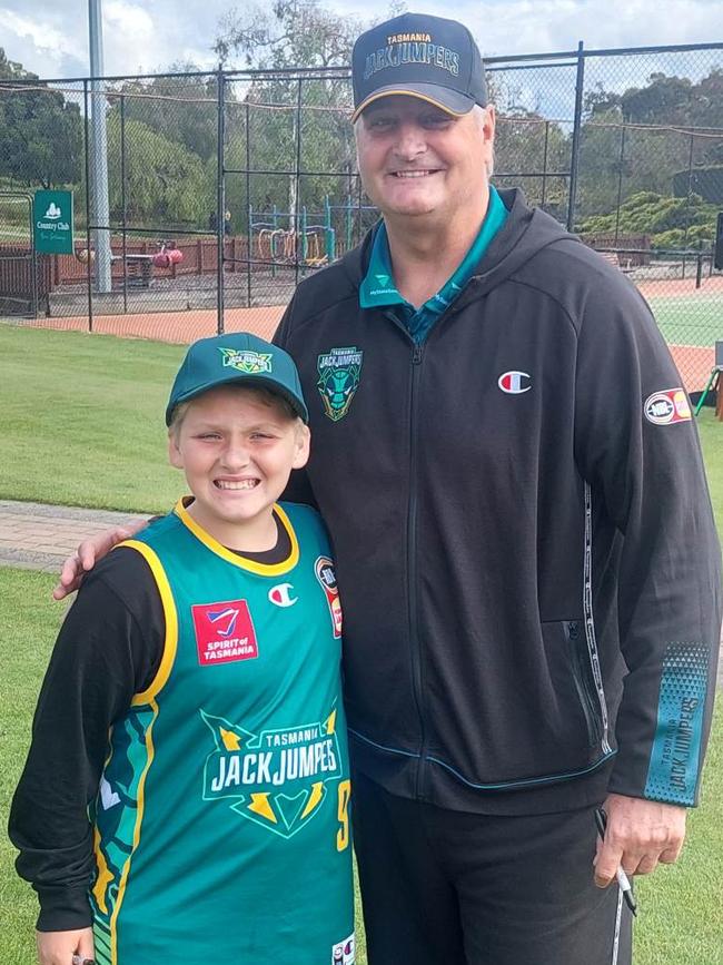 Zachary Kooistra, 10, with Tasmania JackJumpers coach Scott Roth at a team breakfast in Launceston on November 19, 2022 the morning after the intense game.