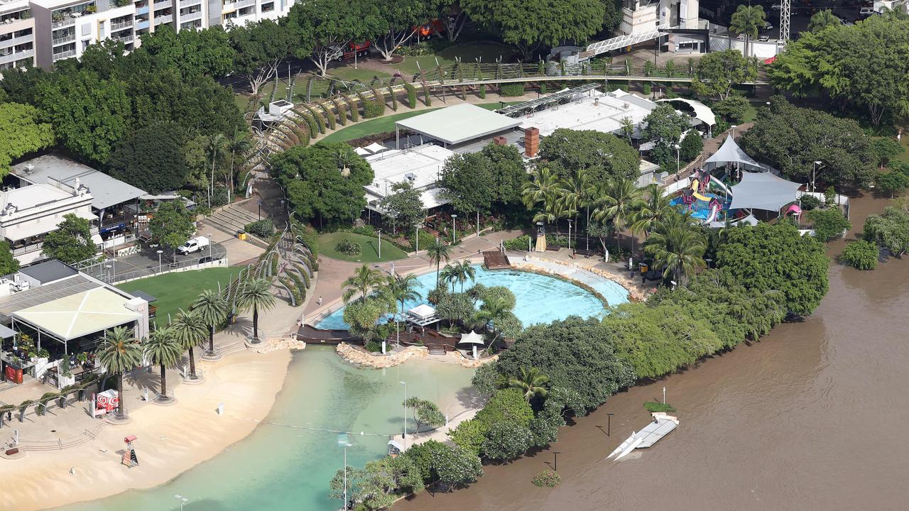 AFTER: South Bank has been hit hard as flood water spills out of the Brisbane river and into the preserved parkland. Picture: Liam Kidston