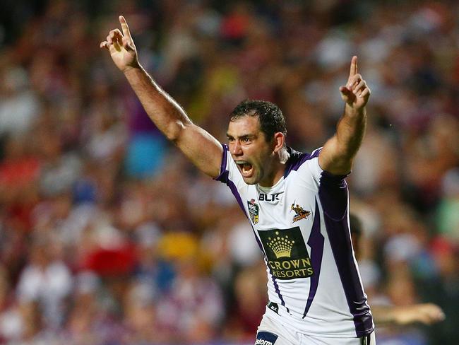 SYDNEY, AUSTRALIA - MARCH 08:  Storm captain Cameron Smith celebrates his winning drop goal in golden point time during the round one NRL match between the Manly Sea Eagles and the Melbourne Storm at Brookvale Oval on March 8, 2014 in Sydney, Australia.  (Photo by Renee McKay/Getty Images)