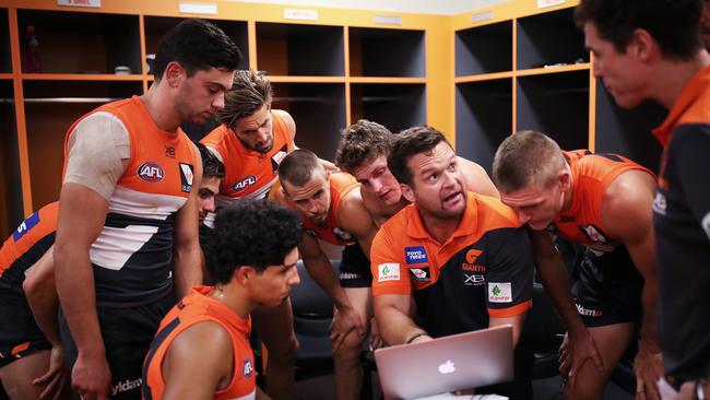 Amon Buchanan talks to the GWS midfield group about their first half. Picture: Phil Hillyard