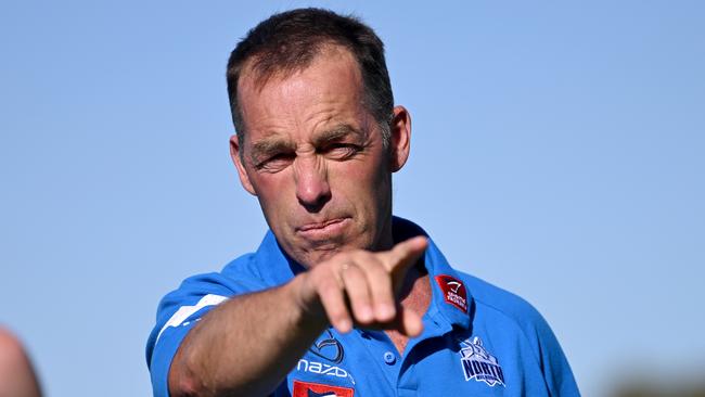 ROCHESTER, AUSTRALIA - FEBRUARY 13: Alastair Clarkson, senior coach of the Kangaroos talks Rochester footballers through a training drill during the North Melbourne Kangaroos AFL Community Camp at the Rochester Recreation Reserve on on February 13, 2023 in Rochester, Australia. (Photo by Morgan Hancock/Getty Images)