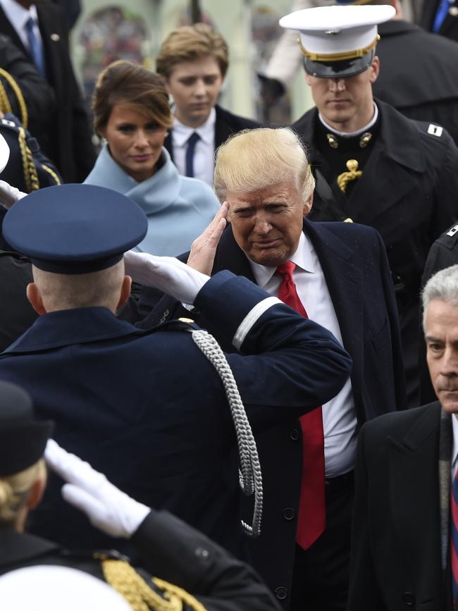 President Donald Trump salutes military personnel as he leaves Capitol Hill in Washington on January 20, 2017, after taking the presidential oath. Picture: AP