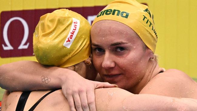 Ariarne Titmus embraces O’Callaghan after the pair hit the wall in the final of the women's 200m freestyle. Picture: Philip Fong/AFP