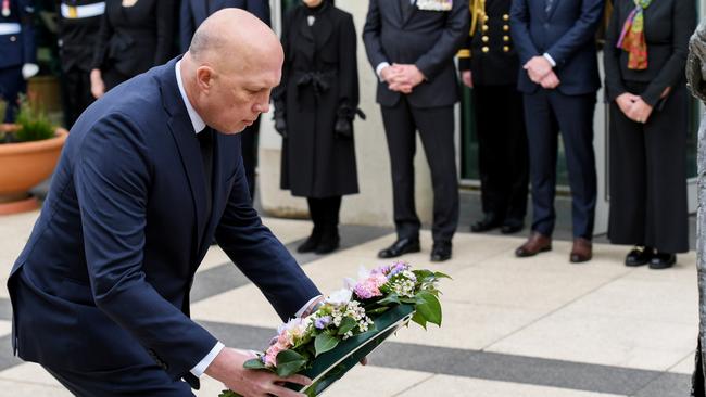 Opposition Leader Peter Dutton lays a wreath at the statue of Queen Elizabeth II at the Australian Parliament House. Picture: Tracey Nearmy