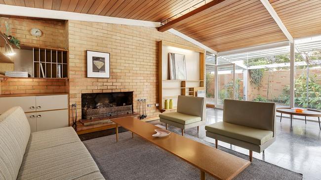 Pale exposed bricks and a timber panelled roof work together beautifully.