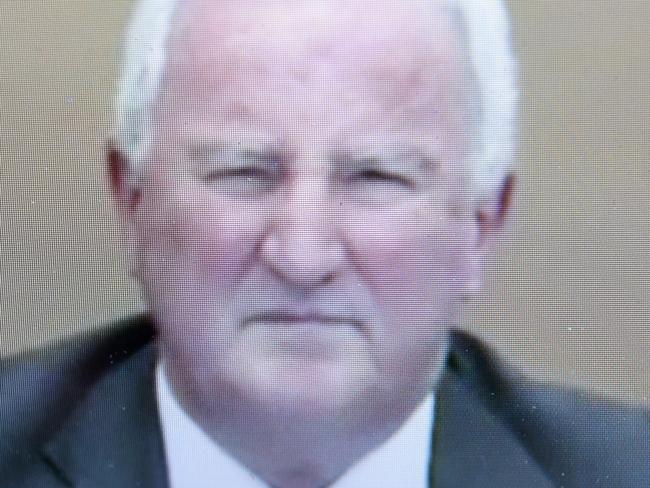 A screen shot of former music teacher and convicted paedophile Gregory Robert Knight giving evidence via a video link to the child sex abuse royal commission at the Magistrates Court in Brisbane, Tuesday, Nov. 10, 2015. Knight was accused of abusing boys in the late 1970's and 80's in schools including St Paul's School in Bald Hills, Brisbane. (AAP Image/Dan Peled) NO ARCHIVING
