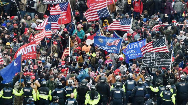 The mob clashes with police and security forces as they attempt to storm the US Capitol in Washington, DC on January 6. Picture: AFP