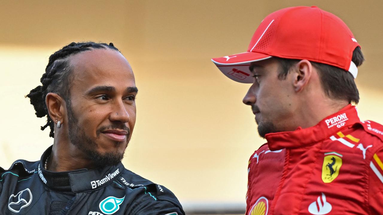 Mercedes' British driver Lewis Hamilton (L) and Ferrari's Monegasque driver Charles Leclerc attend the drivers' parade before the start of the Bahrain Formula One Grand Prix at the Bahrain International Circuit in Sakhir on March 2, 2024. (Photo by ANDREJ ISAKOVIC / AFP)