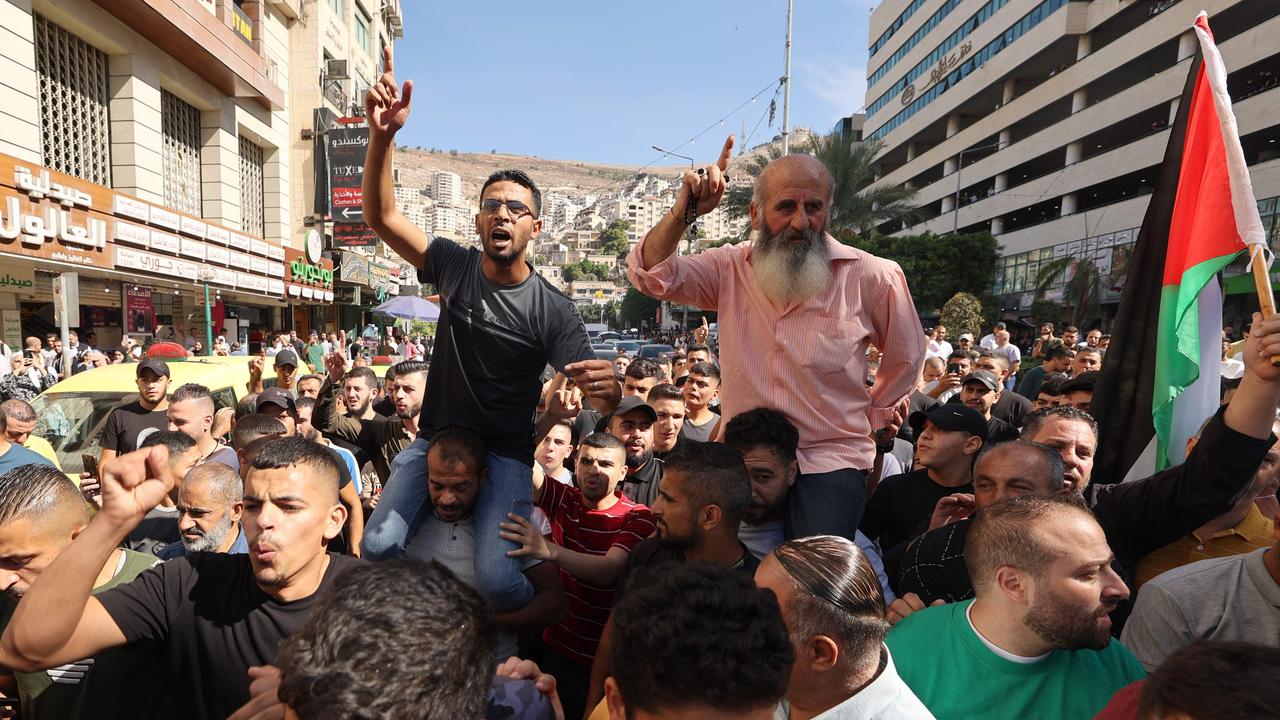 Palestinians celebrate on October 7, 2023, after fighters from the Gaza Strip infiltrated Israel. Picture: Jaafar Ashtiyeh/AFP