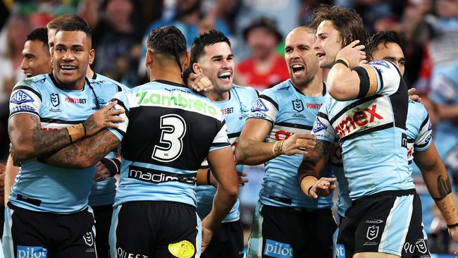 The Sharks celebrate a try. (Photo by Hannah Peters/Getty Images)