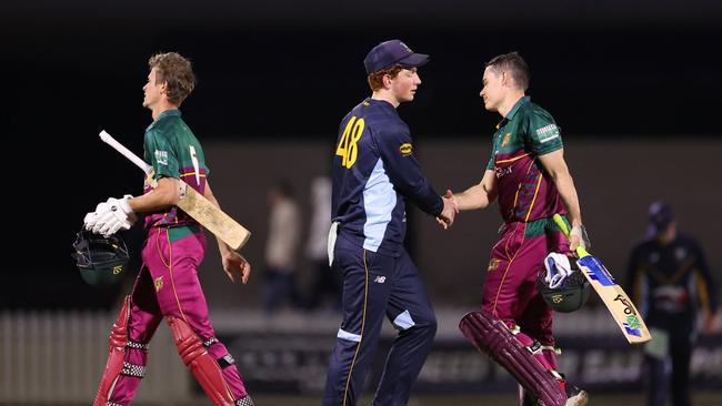 Hugh Weibgen in shaking hands with Brisbane Heat and Queensland cricketer Sam Heazlett during the T20 Max competition. Photo: Queensland Premier Cricket.