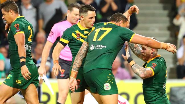 MELBOURNE, AUSTRALIA - OCTOBER 27: Josh Dugan of the Kangaroos is congratulated by his teammates after scoring a try during the 2017 Rugby League World Cup match between the Australian Kangaroos and England at AAMI Park on October 27, 2017 in Melbourne, Australia. (Photo by Scott Barbour/Getty Images)