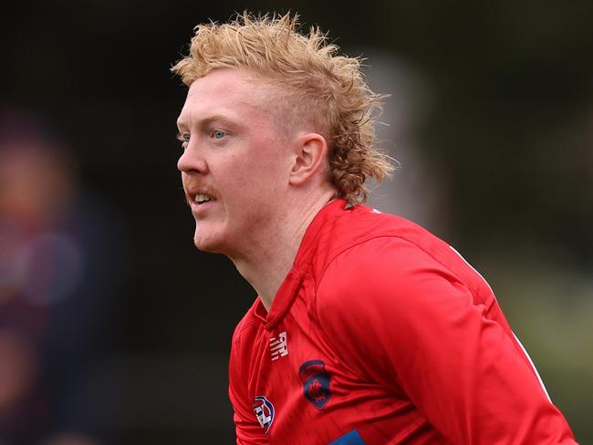 MELBOURNE, AUSTRALIA - APRIL 10: Clayton Oliver of the Demons handballs during a Melbourne Demons AFL training session at Gosch's Paddock on April 10, 2024 in Melbourne, Australia. (Photo by Robert Cianflone/Getty Images)