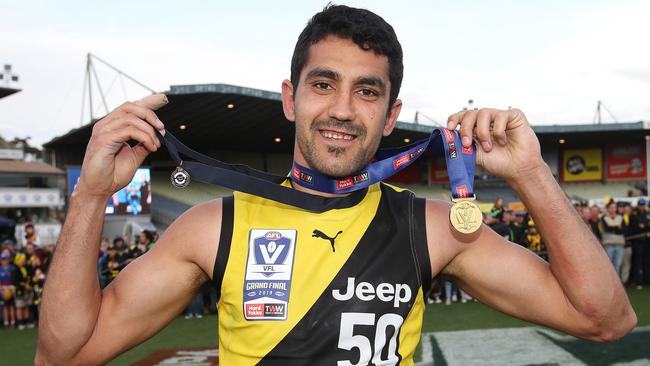 Marlion Pickett receives the Norm Goss Medal as the best player in the VFL grand final. Pic: Michael Klein.