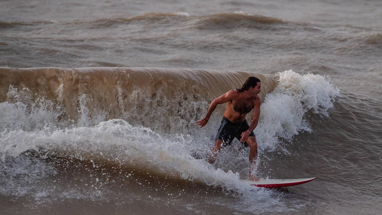 Surfing Top End-style at Nightcliff beach. Picture: Pema Tamang Pakhrin