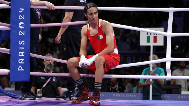 Khelif is left awkwardly sitting on the ring rope. (Photo by Richard Pelham/Getty Images)