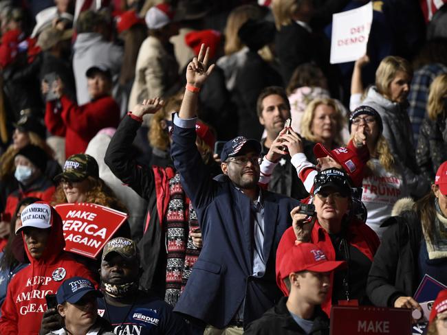 Supporters cheer as Donald Trump speaks during a rally to support Republican Senate candidates at Valdosta Regional Airport in Valdosta, Georgia. Picture: AFP