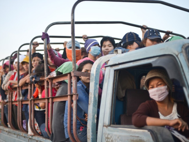 Workers pictured travelling to the factory at 6:30am. Despite long commutes, workers are often forced to work overtime in factories and risk retaliation if they refuse. Picture: Samer Muscati/Human Rights Watch.