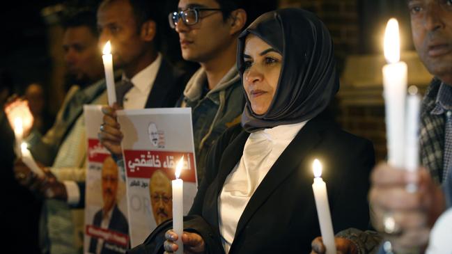 Saudi officials now admit the ‘killing was premeditated’: a vigil for Jamal Khashoggi outside Riyadh’s consulate in Istanbul yesterday. Picture: AP