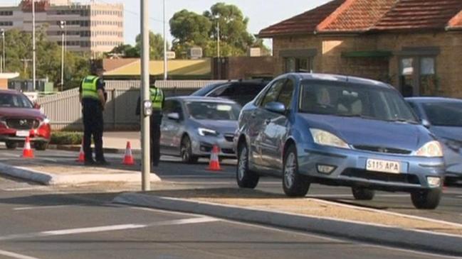 A man has been rushed to hospital with serious injuries after being struck by a car at a pedestrian crossing on busy Sturt Road at Marion. Picture: 7NEWS