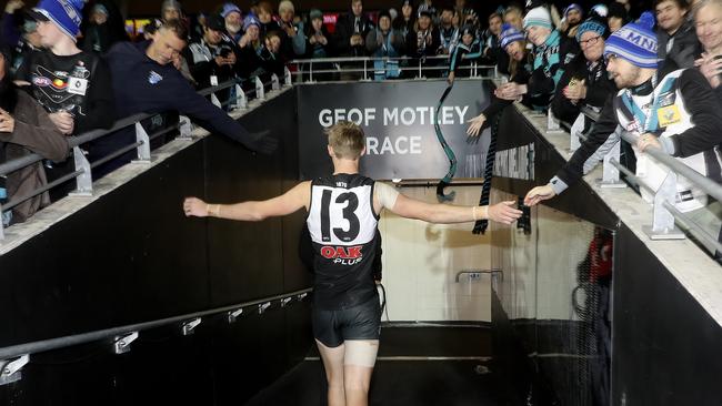 After an emotional first game back after the death of his father Todd Marshall walks down the race to gather himself before walking off with his team. Picture SARAH REED