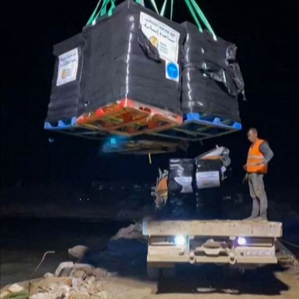 Members of the World Central Kitchenunloading food aid for the Gaza Strip from the Open Arms vessel, onto the shore of the besieged Palestinian territory in March. Picture: World Central Kitchen/AFP