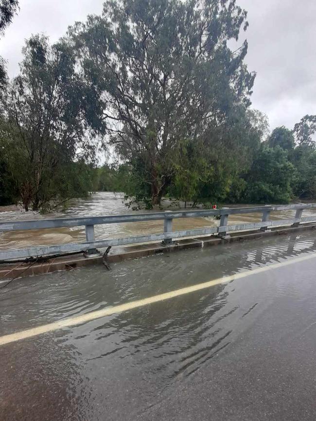 Bohle River over one side of the bridge, road closed heading outbound to Hervey Range. Picture: Shae Beplate