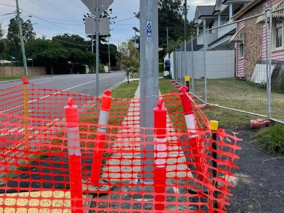 The light pole in the middle of the footpath in Graceville, which a Council committee heard at May 28's meeting was "not finished yet''. Picture: Facebook/Nicole Johnston