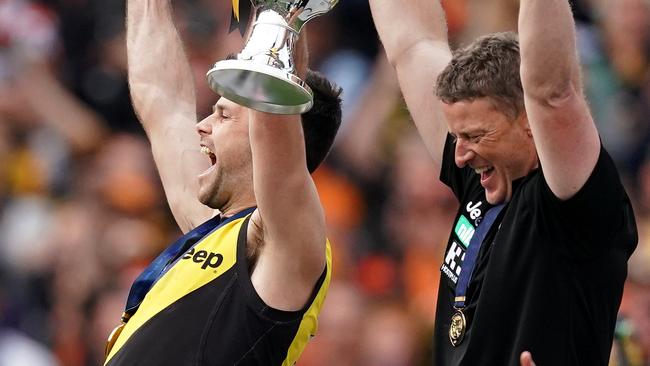 Trent Cotchin and Damien Hardwick hold up the premiership cup. Pic: AAP