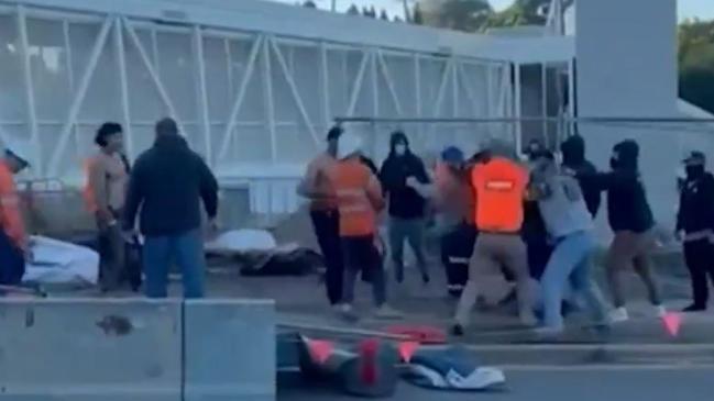 Vision has emerged of a wild brawl between striking tradies and non-union workers who tried to cross a picket line at one of the sites of Queensland's largest infrastructure project.