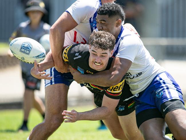 Mitchell Heather is taken out by Bulldogs player Sosaia Kaufusi Picture: Julian Andrews