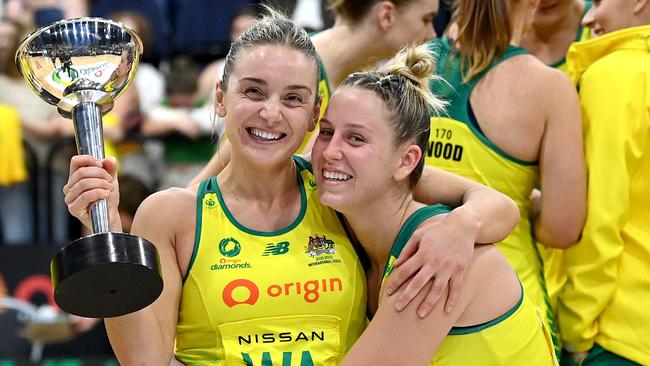 Jamie-Lee Price and Liz Watson embrace after a difficult week for Australian netball. Picture: Bradley Kanaris/Getty Images