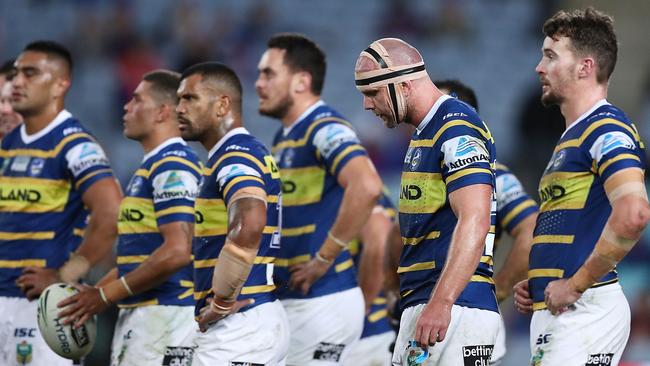 Eels players look dejected after conceding a try to the Knights. Pic: Getty Images