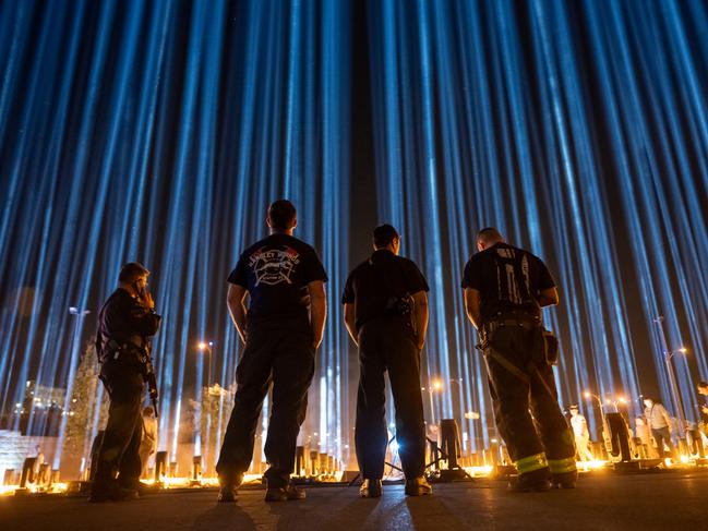 JERUSALEM, ISRAEL - OCTOBER 30: Firefighters  visit the Lights of Hope installation featuring photos of the hostages on October 30, 2023 in Jerusalem, Israel. The installation features 224 lights corresponding to the believed number  of hostages as of 48 hours ago.  As the Israeli government vows to eliminate Hamas, whose Oct 7 attacks left 1,400 dead and 230 kidnapped, the fate of those hostages has complicated the country's military response. Families of the victims worry that the military offensive may result in hostages being killed during Israeli bombing or from Hamas's reprisals. Some families and friends of hostages, who remain in Gaza, are calling on the government to trade for Palestinian prisoners. (Photo by Alexi J. Rosenfeld/Getty Images)