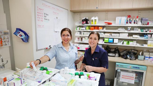 Joanna Donnelly and Yamuna Kafle inside the medical clinic’s pharmacy. Picture: Rohan Kelly