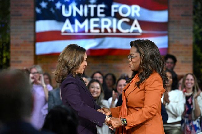 US Vice President and Democratic presidential candidate Kamala Harris (L) joins US television producer Oprah Winfrey at a 'Unite for America' live streaming rally in Farmington Hills, Michigan, on September 19, 2024