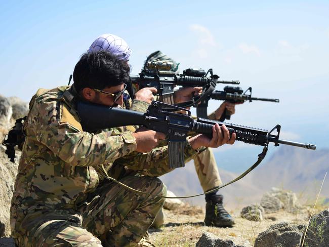 Afghan resistance movement and anti-Taliban uprising forces take positions as they patrol on a hilltop in Panjshir province. Picture: AFP