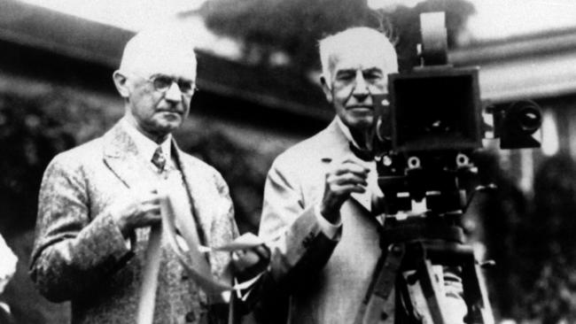 Inventor Thomas Edison (right) inspires Cat Harry Taylor to keep trying.