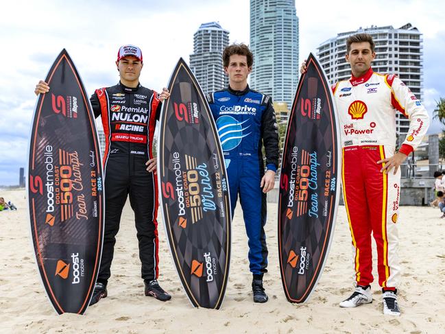 Supercars drivers James Golding, Aaron Love and Andre De Pasquale with the 2024 GC500 trophies on Surfers Paradise beach. Picture: Supplied