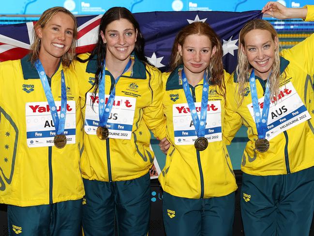 MELBOURNE . 13/12/2022. World Short Course Swimming Championships at Melbourne Sports and Aquatic centre, Melbourne. The Australian 4 x 100 mtr women relay team. , Emma McKeon, Meg Harris, Mollie OÃ&#149;Callaghan and Madi Wilson after winning gold and breaking the world record . Picture by Michael Klein