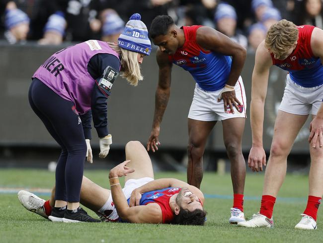 Christian Petracca after suffering the heavy hit against the Pies. Photo: Michael Klein