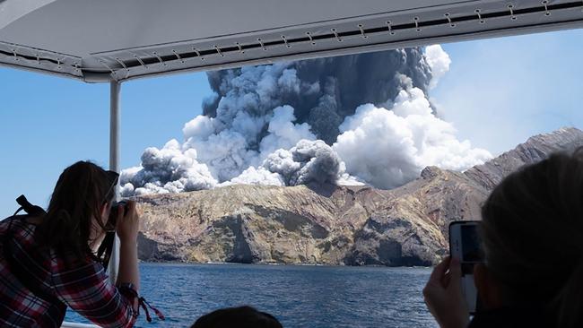 The volcano on New Zealand's White Island spewing steam and ash moments after it erupted. Picture: Michael Schade / AFP