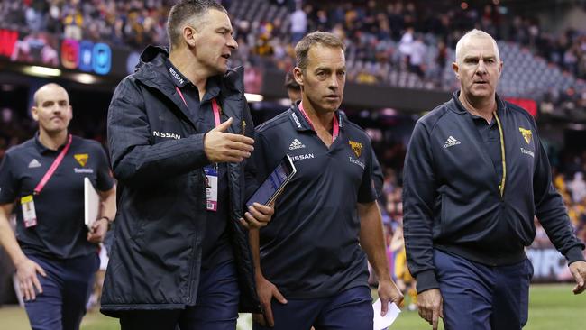 Hawthorn coach Alastair Clarkson with assistant Adam Yze, left, and footy manager Graham Wright. Picture: Michael Klein