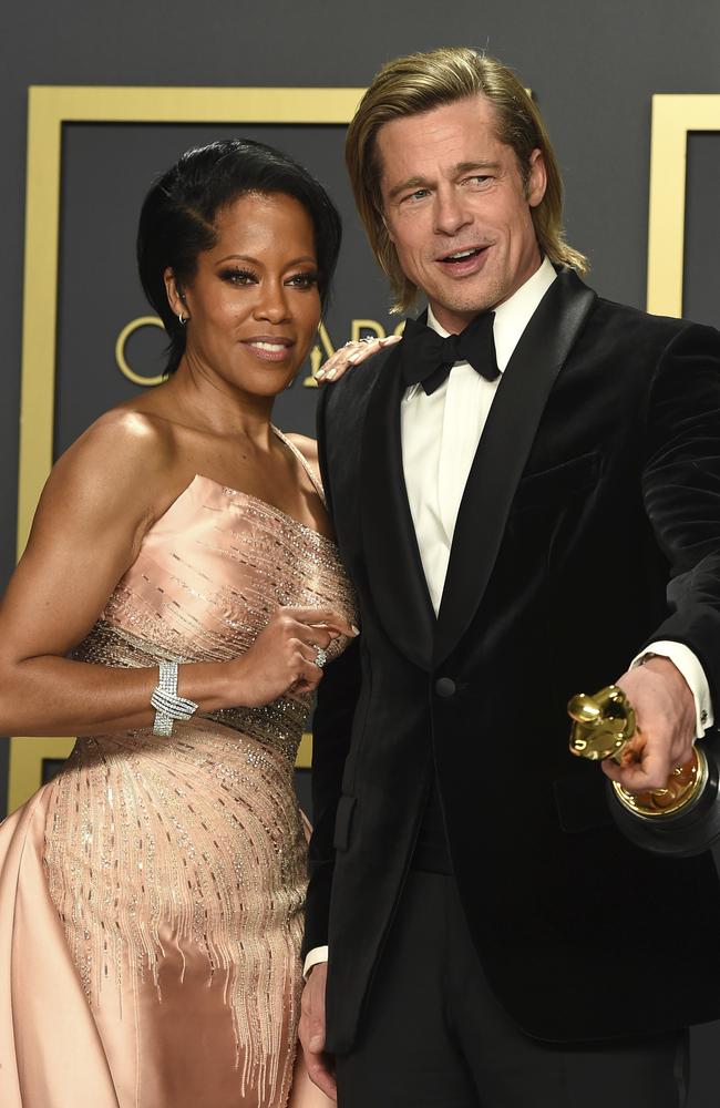 Regina King poses with Brad Pitt backstage after his Oscars win. Picture: AP